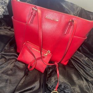 red Michael Kors bag with matching  wallet